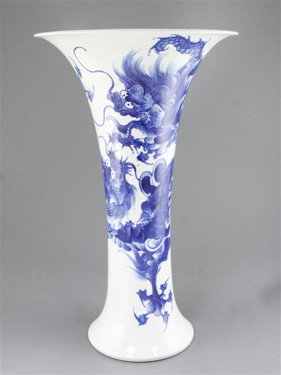 A large Japanese blue and white trumpet shaped vase, by Makuzu Kozan II (Miyagawa Hanzan, 1858-1940), 59.5cm, two hairline rim cracks